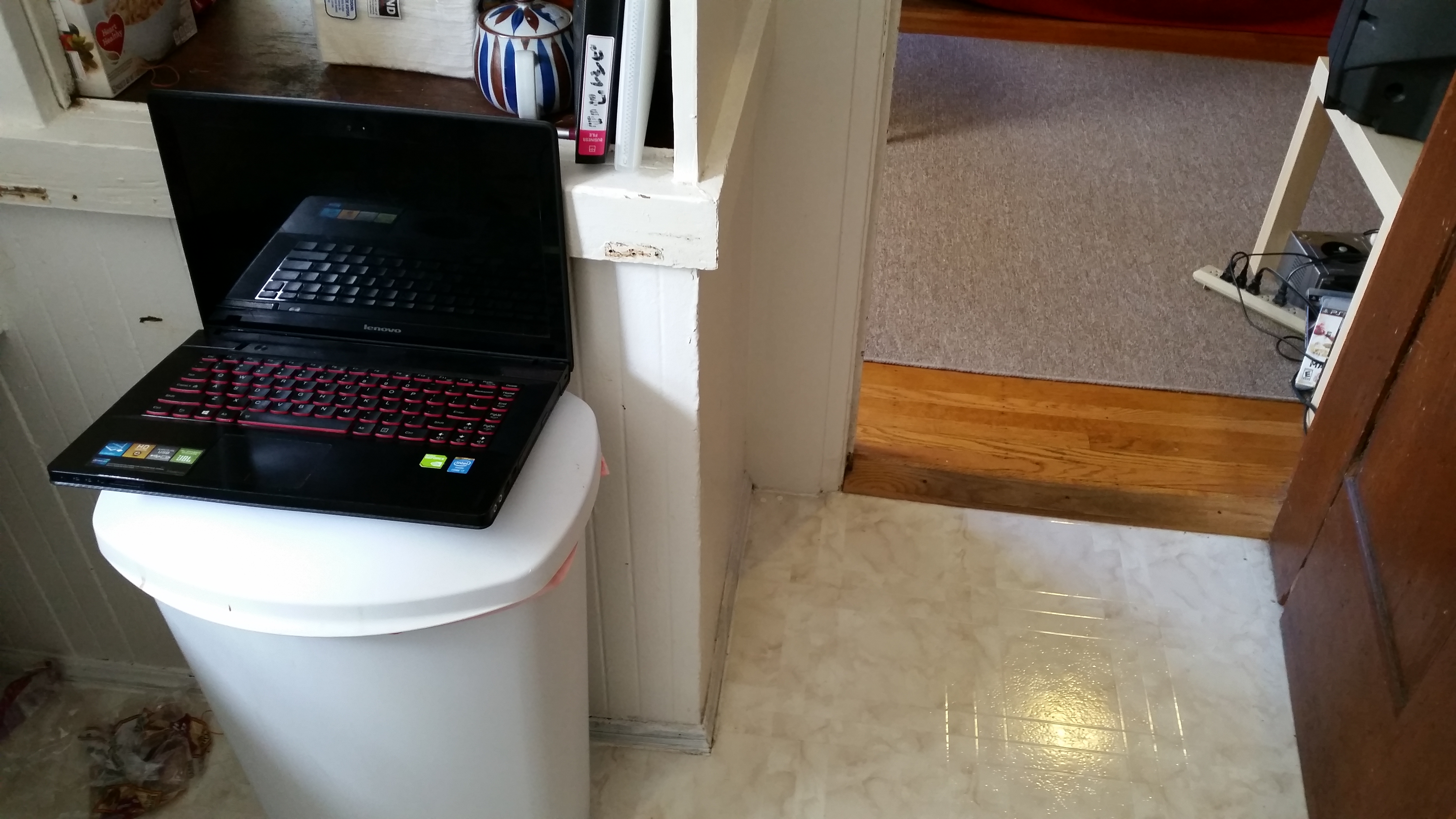 laptop on trashcan